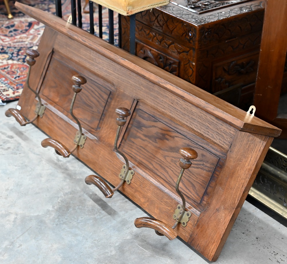 A panelled oak hall shelf with four wrought iron hat/coat hooks, 100 cm wide x 40 cm high to/w a - Image 2 of 5