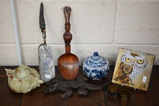 A ceramic tile with cartoon owl, a blue and white bowl and cover, Chinese soapstone wine-jug and