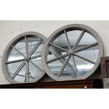 A pair of 'Cartwheel' mirrors in grey painted frames, 85 cm diam