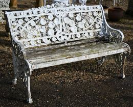 A weathered and white painted Coalbrookdale style cast alloy garden bench