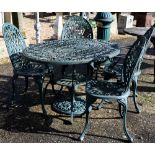 A Victorian style green painted five-piece green terrace dining set comprising a table and four