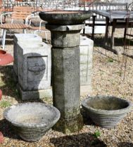 A weathered cast stone column birdbath to/with a pair of conical form planters (3)