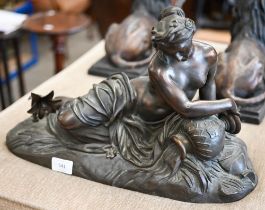 A 19th century brown-patinated bronze, semi-clad classical female, reclining by a stream,