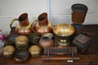 A pair of copper and brass jugs, to/w seven Indian brass bowls and a stemmed bowl, a vintage brass