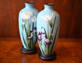 A pair of early 20th century Japanese cloisonne polychrome vases with purple and white irises