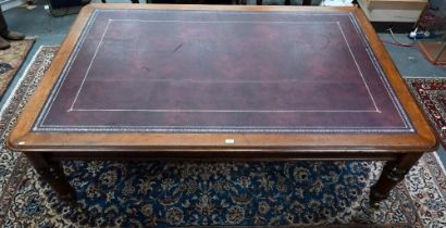 A 19th century mahogany library table, the silver tooled burgundy leather inset top over a pair of