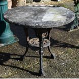 An old cast iron 'Brittania' tavern table with circular stone top