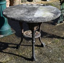 An old cast iron 'Brittania' tavern table with circular stone top