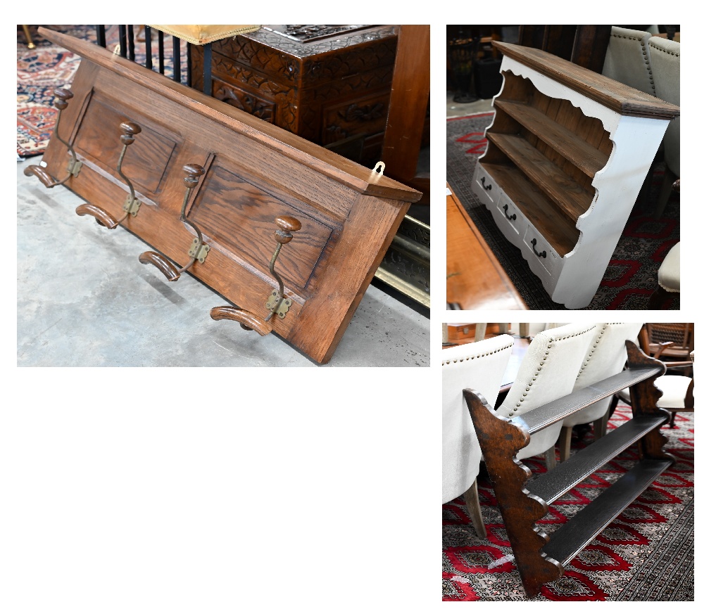 A panelled oak hall shelf with four wrought iron hat/coat hooks, 100 cm wide x 40 cm high to/w a