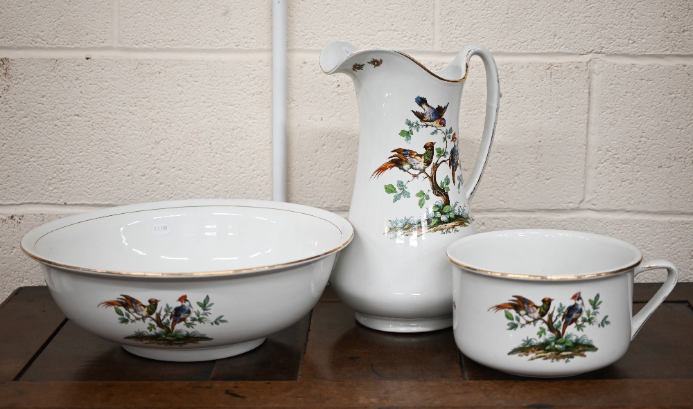 A Newport pottery (Burslem) ewer, basin and chamberpot set, printed with birds