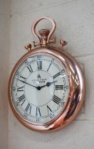 A novelty wall clock in the form of an outsize pocket watch with battery movement