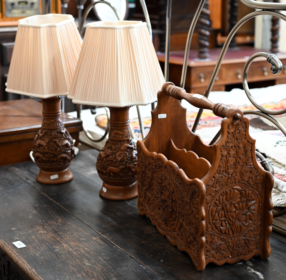 A pair of Indian carved table lamps with shades to/w Indian cane and hardwood magazine/newspaper