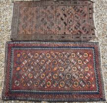An old Balouchi brown ground rug with repeating octagonal gul design, 212 x 131 cm to/w Afghan rug