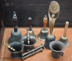 Three antique metal mortars and four pestles, to/w four hand-bells and a Foster-Denovo figural