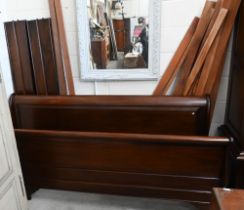 A modern stained hardwood super king size sleigh bed frame, 190 cm wide