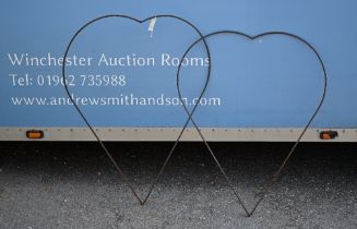 A pair of weathered steel heart shaped garden plant frames, 80 cm w x 105 cm h