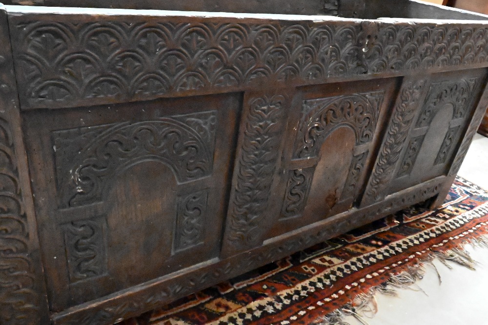 A large 18th century carved oak coffer/blanket chest (a/f), 132 cm wide x 60 cm deep x 62 cm high - Image 5 of 6