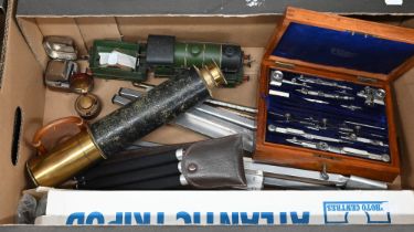 A box of drawing instruments, a three-draw telescope, Hornby Type 501 clockwork locomotive and