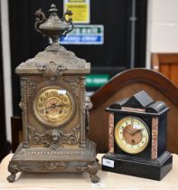 A German brass cased mantel clock striking on a coiled gong 50 cm high oevrall to/w a slated
