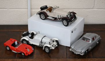 Four Burago model cars