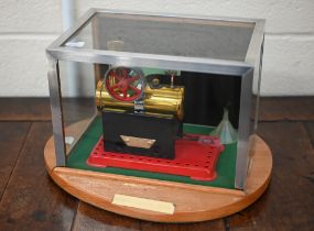A Mamod static steam engine in glass display-case