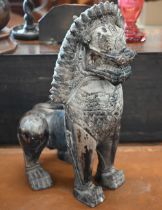 An Asian bronzed ceramic temple lion, 53cm high