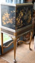 A mid-century Georgian style black Japanned and gilt pictorial cabinet on stand, the twin doors