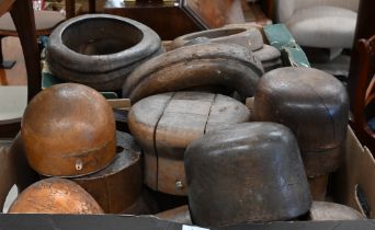 A good collection of antique milliner's wooden hat blocks and brims, all unnamed, two numbered