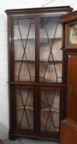 A 19th century mahogany floor standing corner cupboard with astragal glazed doors, 100 cm wide x 210