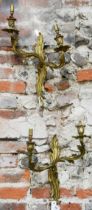 A pair of Rococo style two branch ormolu wall sconces, 42 cm h, bright but tarnished, one arm