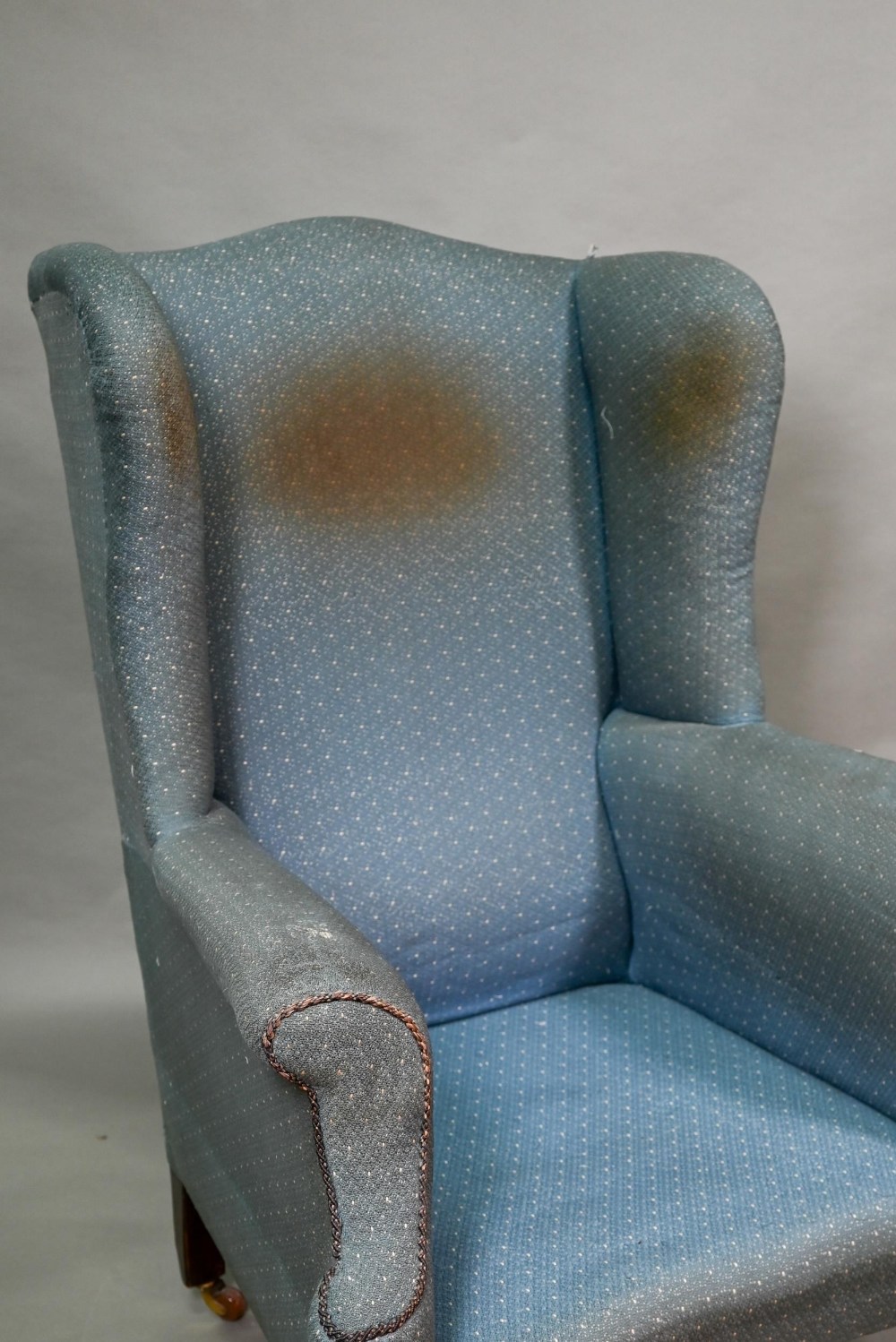 A traditionally upholstered Queen Anne style wing armchair, with concave seat front, raised on short - Image 3 of 14