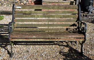 A teak slat garden bench with cast alloy ends