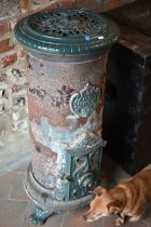 An early 20th century French Godin part enamelled and cast iron stove / greenhouse heater