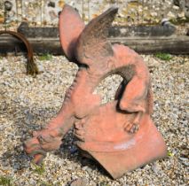 A reconstituted aged terracotta large 'dragon' ridge tile, 65 cm high
