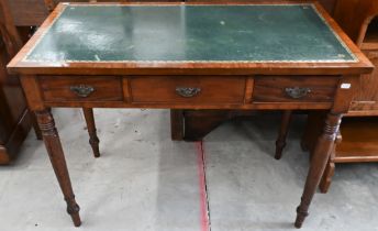 A 19th century mahogany three drawer writing table with gilt tooled leather top and turned supports,