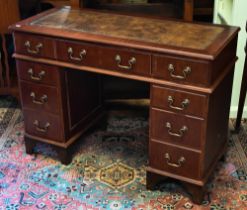 A reproduction mahogany twin pedestal desk with tooled leather top, 104 x 44 x 74 cm h