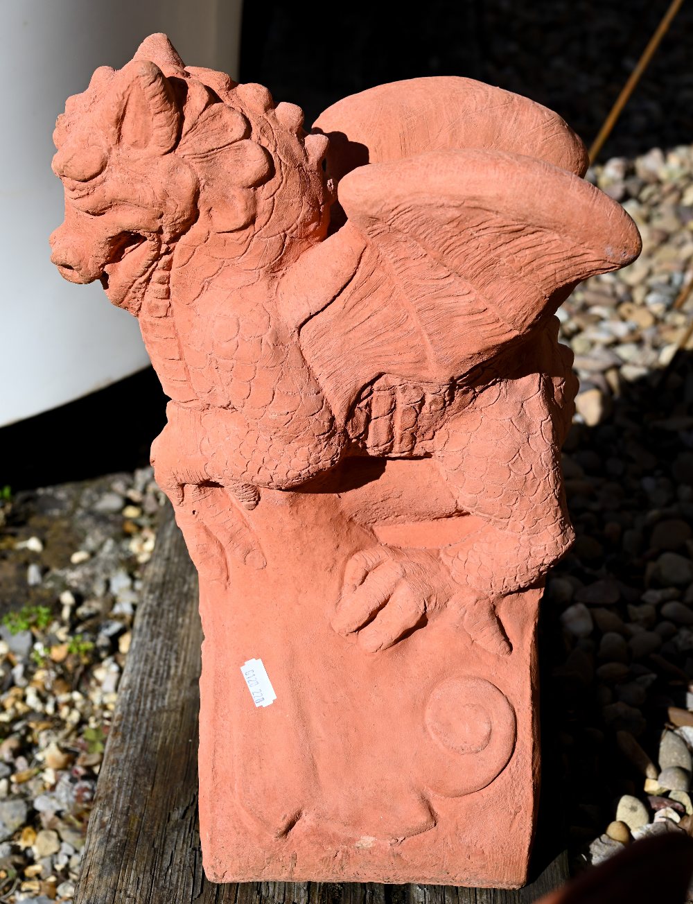 A small cast terracotta dragon ridge tile, 45 cm h