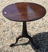 A 19th century mahogany tilt-top table on gun barrel turned column and triform supports