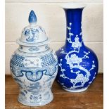 A Chinese blue and white bottle vase, painted with almond blossom 45 cm high, to/w blue and white