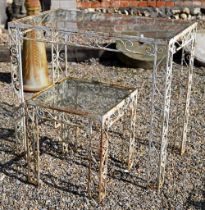 A vintage wrought steel glass top garden table, 87.5 cm x 49.5 cm x 77 cm h to/with another