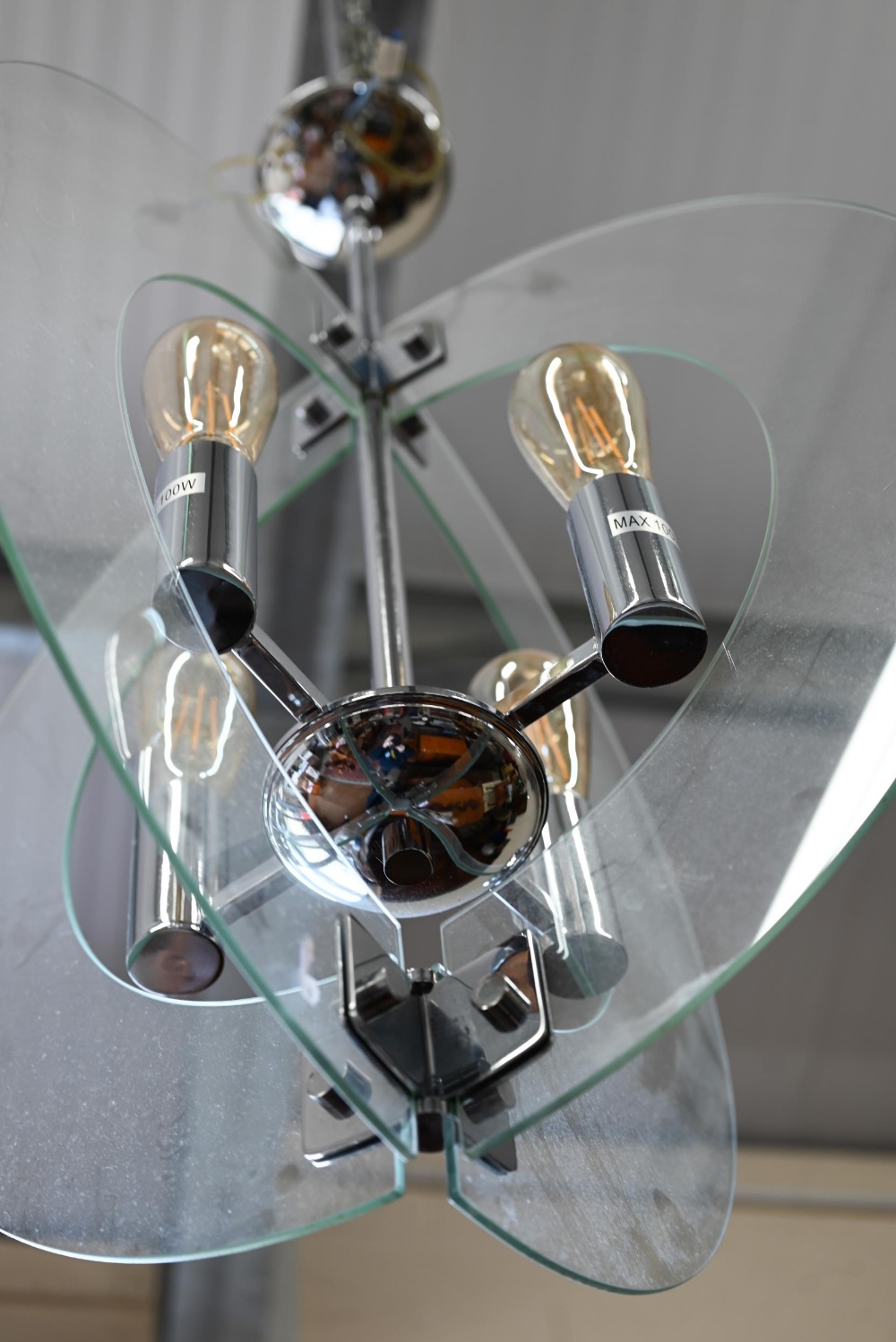 A contemporary 'solstice' stem hung four-light ceiling pendant in polished chrome with semi-circular - Image 3 of 3