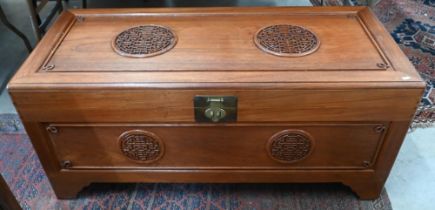 George Zee & Co (Hong Kong) - a mid century Chinese camphorwood trunk with decorative fret cut