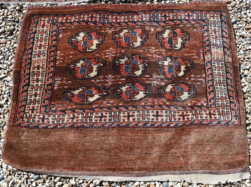 An small antique Turkoman rug, 122 cm x 78 cm to/w a Turkoman bag face, 97 cm x 84 cm and a camel - Image 4 of 6