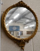 An antique circular wall mirror in giltwood and gesso decorative frame, 50 x 42 cm