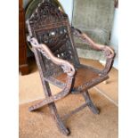 An antique Chinese carved and moulded dragon back chair with hinged seat, a/f