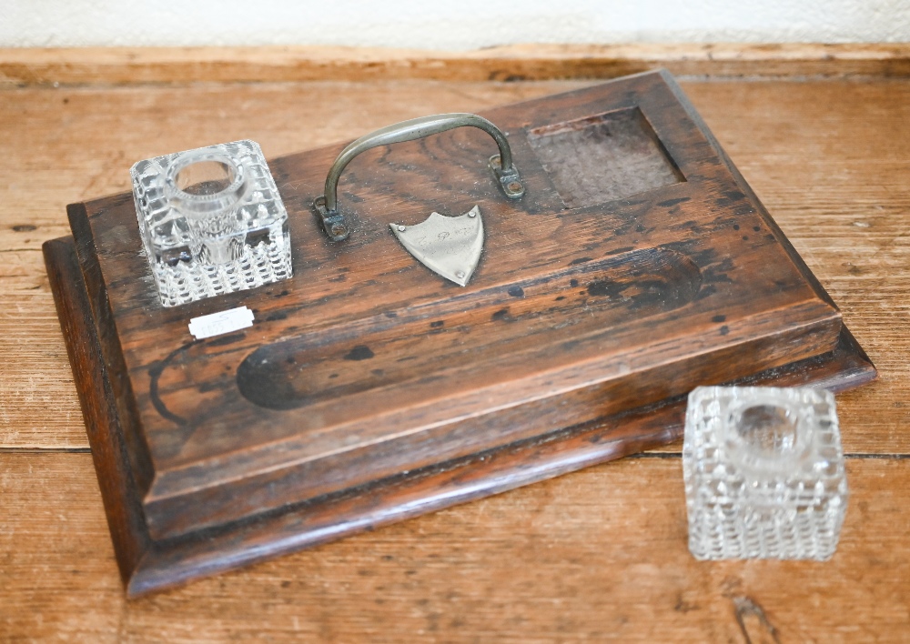 A 19th century oak desk stand with two glass inkwells, 29.5 cm wide