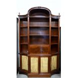 A Federal style mahogany bookcase desk with pen shelves around fall front panel enclosing fitted