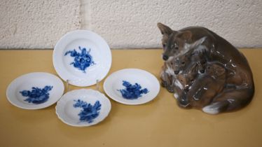 A Royal Copenhagen group, vixen with cubs 1788, to/w four blue and white small dishes (5)