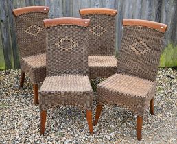 A set of four hardwood and wicker dining chairs (4)
