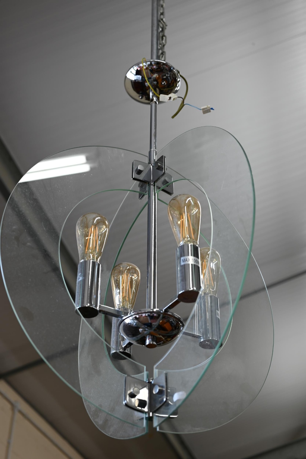 A contemporary 'solstice' stem hung four-light ceiling pendant in polished chrome with semi-circular - Image 2 of 3